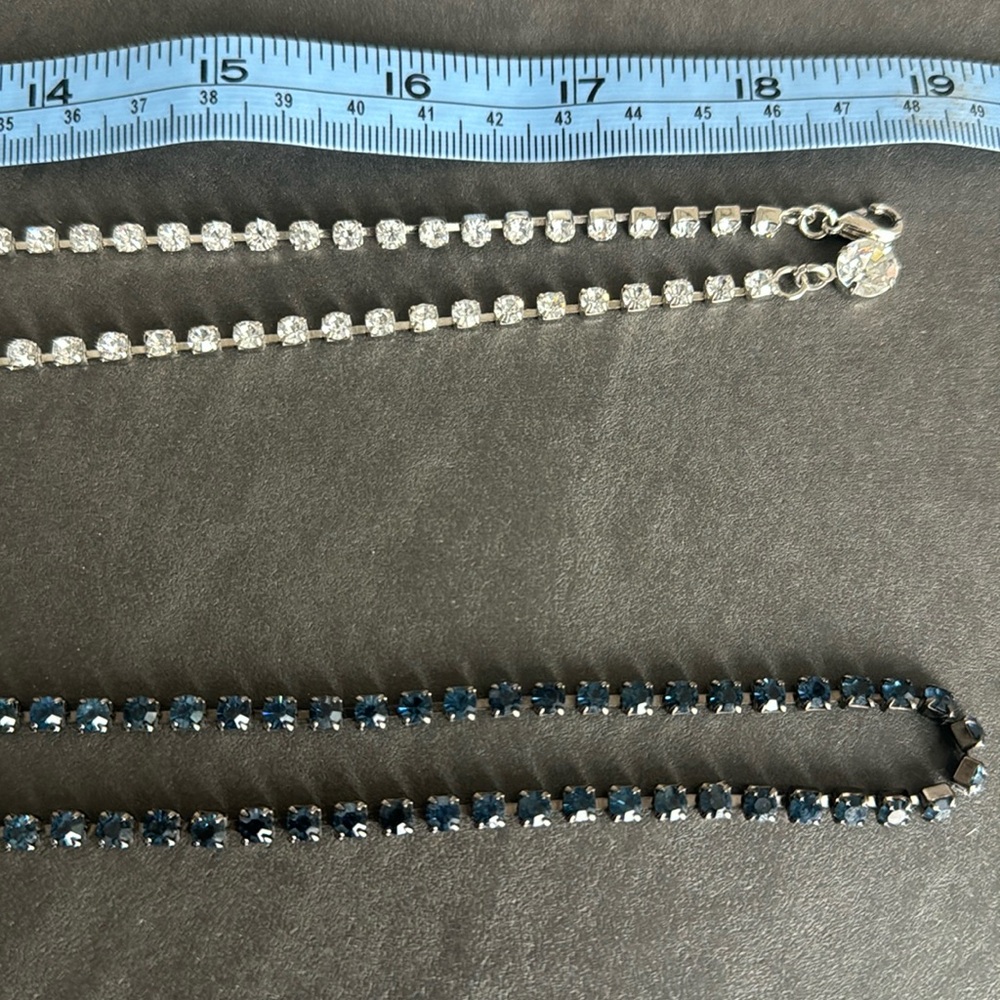 Two rhinestone belts— clear and navy adjustable